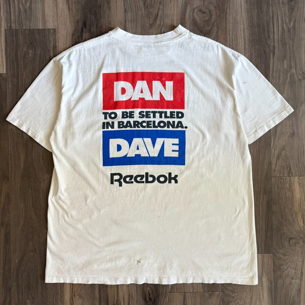 Vintage Reebok Dan Vs Dave Who Is The World's Greatest Athlete T-Shirt Size L